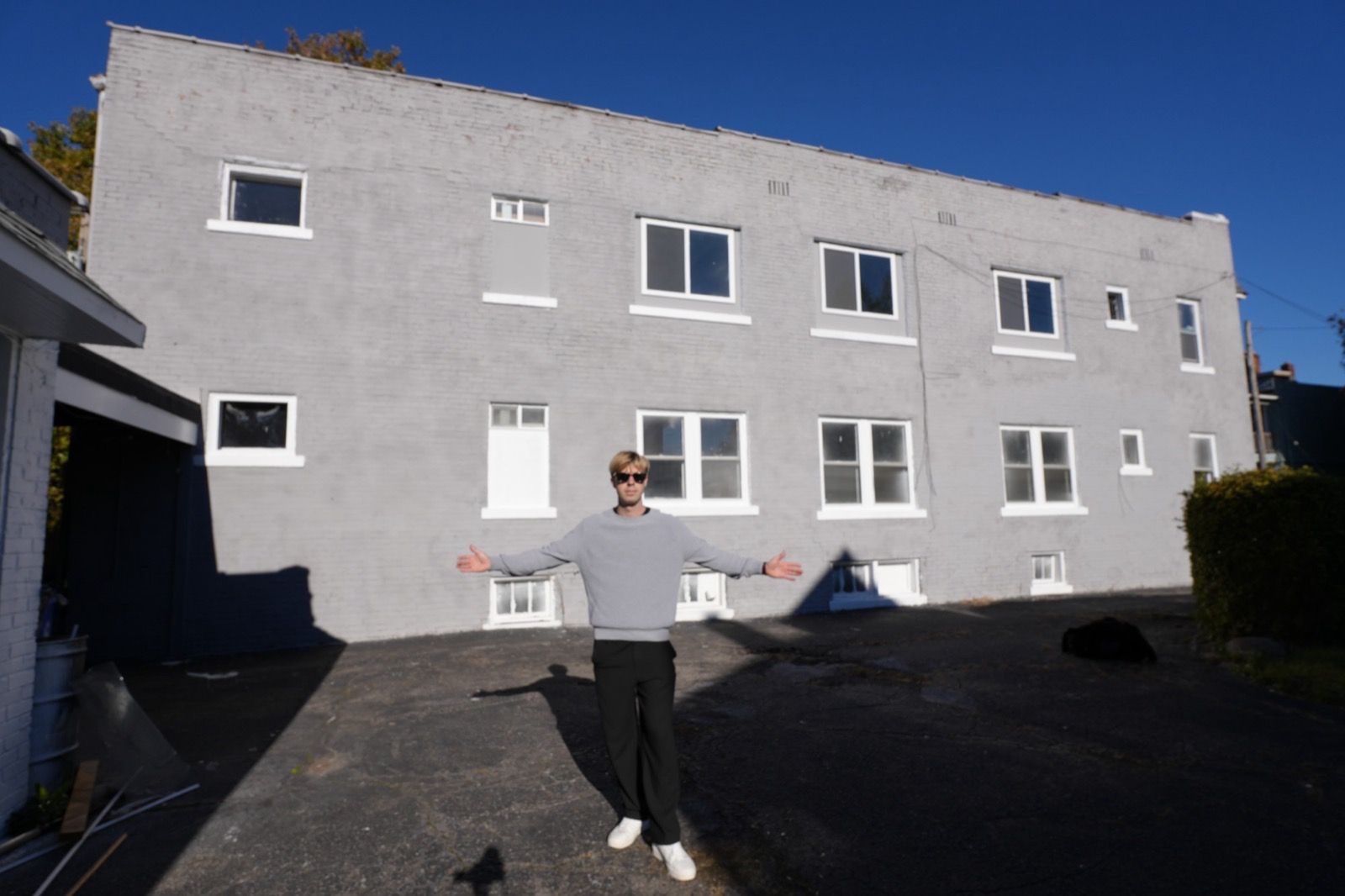 Olaf Groenewegen in front of a multifamily rental building